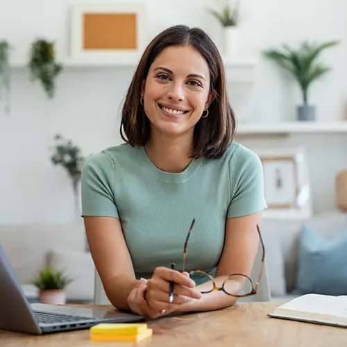 a smiling insurance agent at her desk